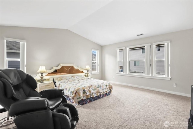 carpeted bedroom with visible vents, baseboards, and lofted ceiling