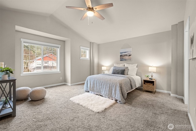 carpeted bedroom with lofted ceiling, ceiling fan, and baseboards