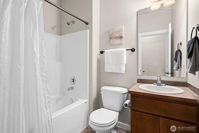 bathroom featuring toilet, shower / tub combo with curtain, and vanity