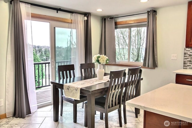 dining space with plenty of natural light and recessed lighting