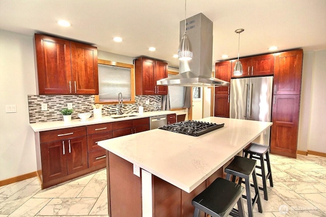 kitchen featuring marble finish floor, island exhaust hood, pendant lighting, and a sink