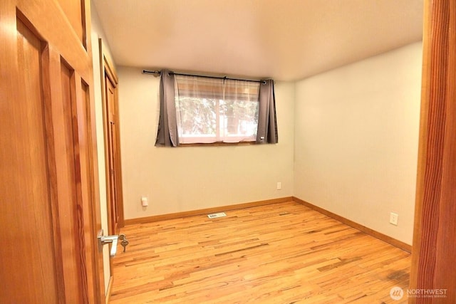 unfurnished bedroom featuring light wood-type flooring, baseboards, and visible vents