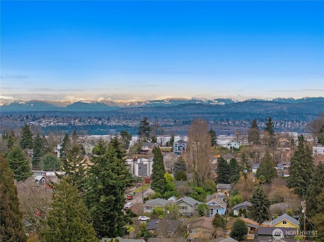 aerial view at dusk with a residential view and a mountain view