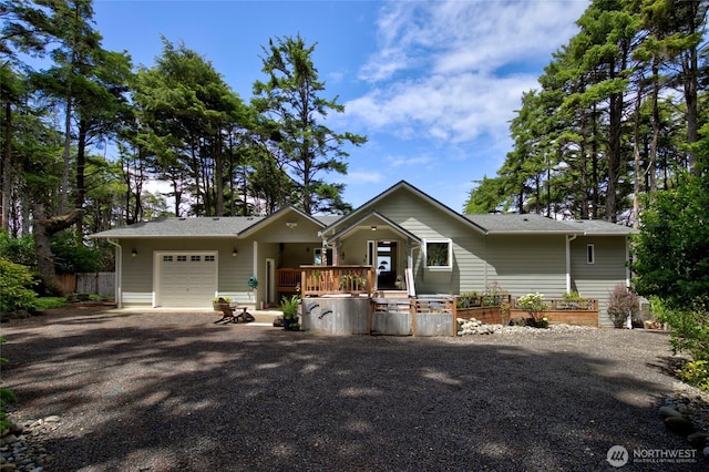 16 Koala Ln, Pacific Beach, WA 98571 - view of front facade with a garage and fence