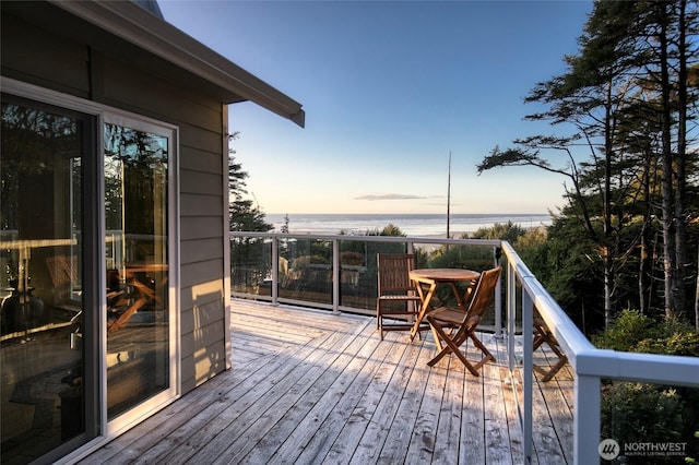 16 Koala Ln, Pacific Beach, WA 98571 - deck at dusk featuring a water view