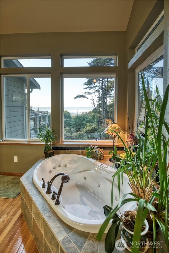 16 Koala Ln, Pacific Beach, WA 98571 - full bath with plenty of natural light, a whirlpool tub, and wood finished floors