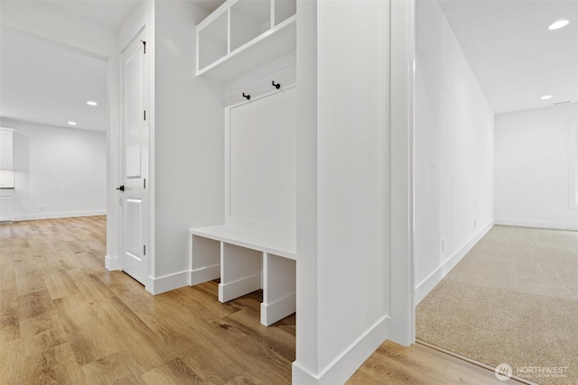 mudroom featuring light wood-style floors, baseboards, and recessed lighting