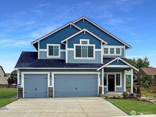 14715 88th Way SE Unit 20, Yelm, WA 98597 - craftsman inspired home with concrete driveway, a garage, stone siding, covered porch, and a shingled roof