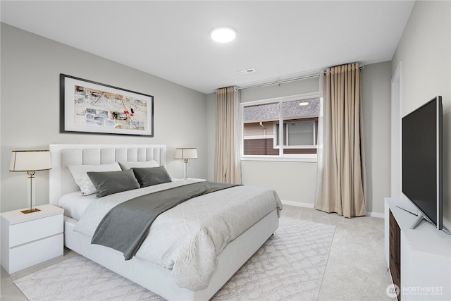 bedroom featuring light carpet, visible vents, and baseboards