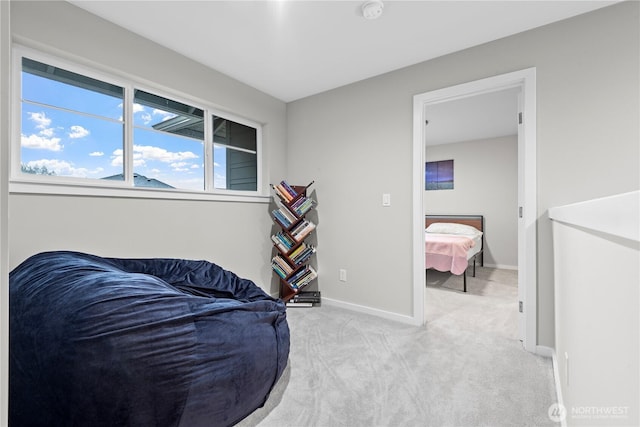 sitting room with light carpet and baseboards