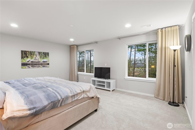 bedroom with light carpet, visible vents, baseboards, and recessed lighting