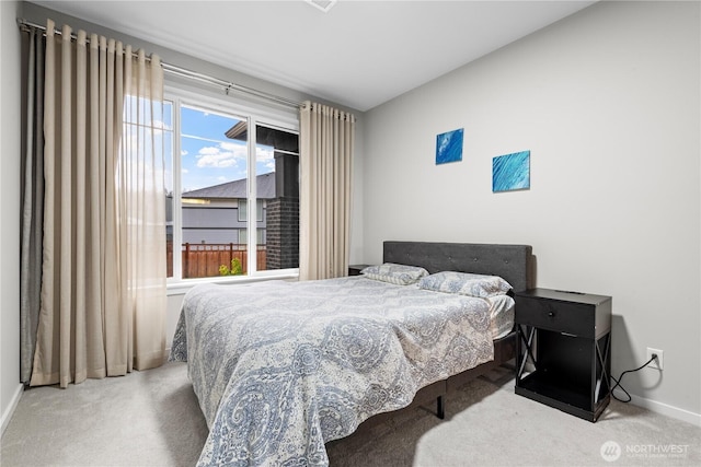 carpeted bedroom with baseboards