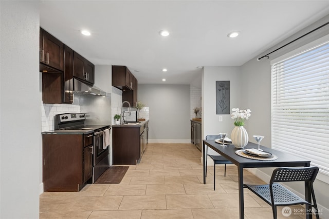 kitchen featuring recessed lighting, backsplash, stainless steel range with electric cooktop, dark brown cabinets, and under cabinet range hood