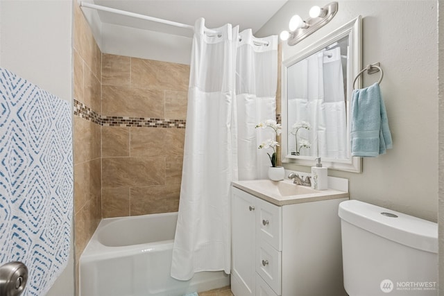 bathroom with toilet, shower / bath combo with shower curtain, and vanity