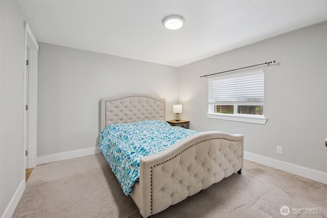 carpeted bedroom featuring baseboards