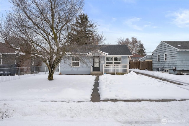 view of front of property featuring fence