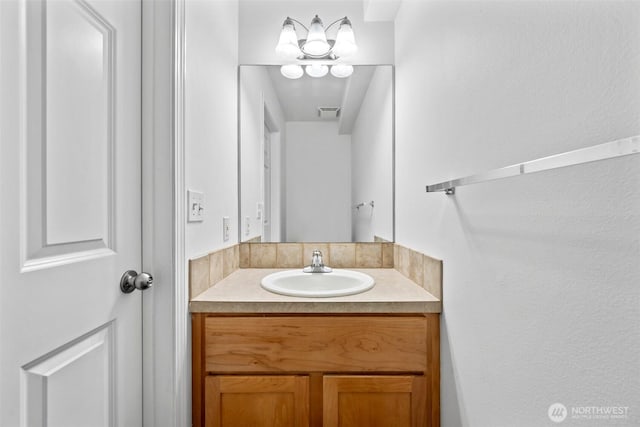 bathroom featuring visible vents and vanity