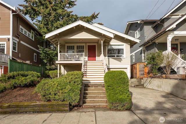 view of front of house with covered porch and stairway