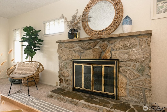 interior details featuring a fireplace and carpet flooring