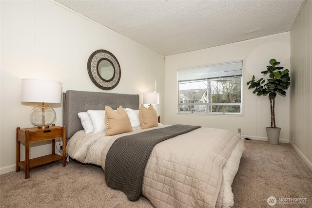 bedroom featuring light carpet and a textured ceiling