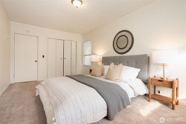 bedroom featuring light carpet and a closet