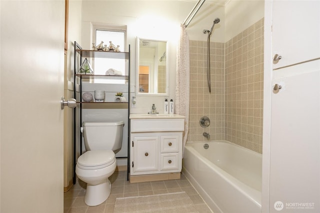 full bathroom featuring toilet, shower / tub combination, vanity, and tile patterned floors