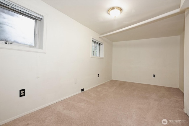 empty room with light colored carpet