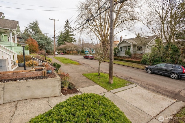 view of street featuring curbs and sidewalks