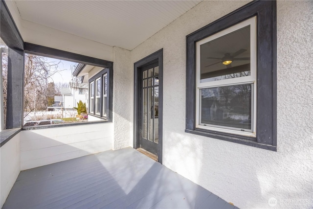 view of exterior entry with stucco siding