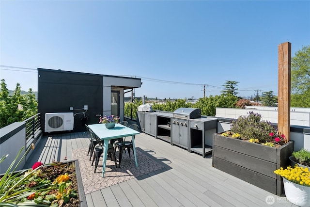 6610 Corson Ave S, Seattle, WA 98108 - deck featuring outdoor dining space, ac unit, grilling area, and an outdoor kitchen