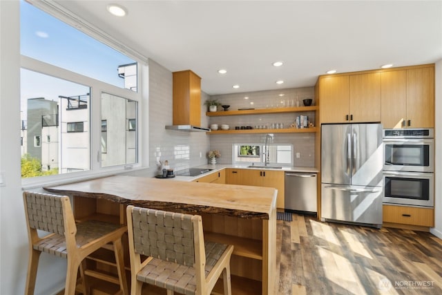 6610 Corson Ave S, Seattle, WA 98108 - kitchen featuring open shelves, light wood-style floors, recessed lighting, a sink, and appliances with stainless steel finishes