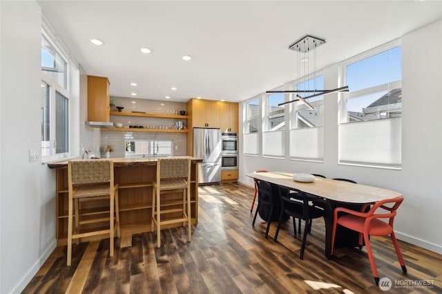 6610 Corson Ave S, Seattle, WA 98108 - dining space featuring baseboards, recessed lighting, and dark wood finished floors