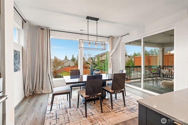 sunroom / solarium featuring a healthy amount of sunlight