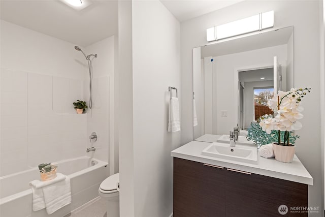 full bath featuring washtub / shower combination, vanity, and toilet