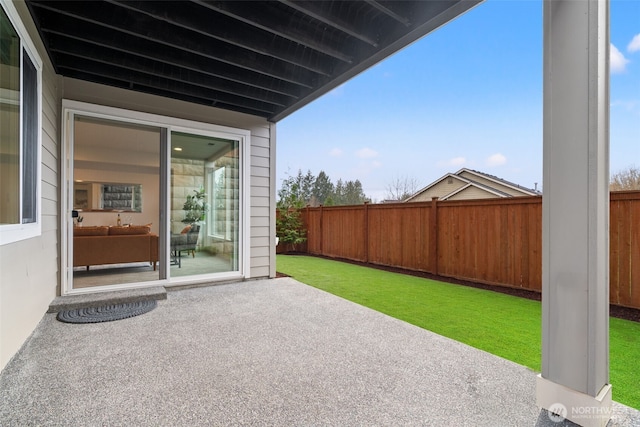 view of patio featuring fence