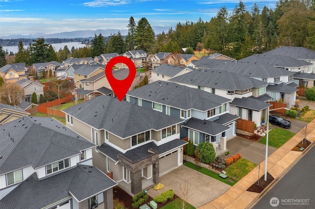 aerial view with a mountain view and a residential view