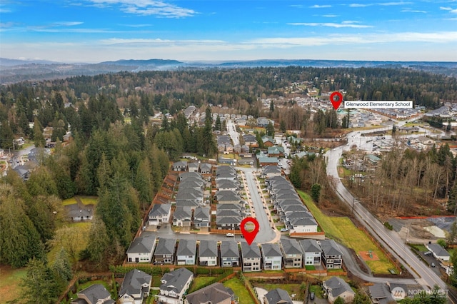 bird's eye view with a residential view and a wooded view