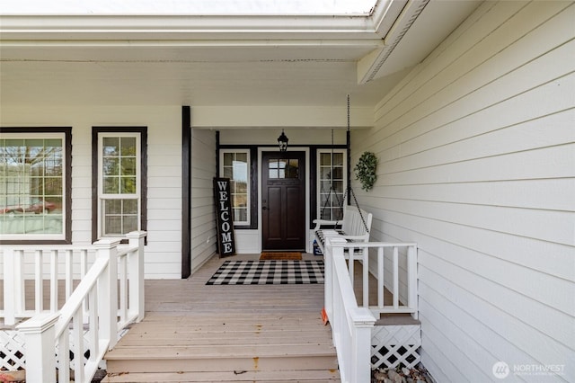 doorway to property with covered porch