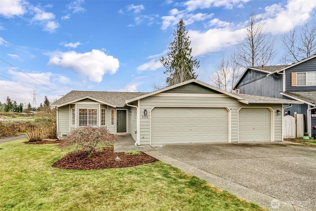 view of front of home featuring driveway, a shingled roof, a garage, and a front lawn