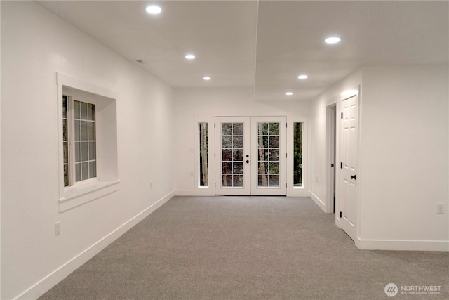 corridor with carpet, french doors, baseboards, and recessed lighting