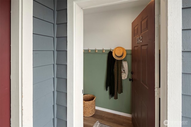 bathroom with wood finished floors and baseboards