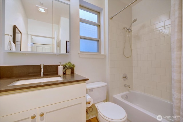 bathroom featuring vanity, toilet, and shower / bathtub combination with curtain