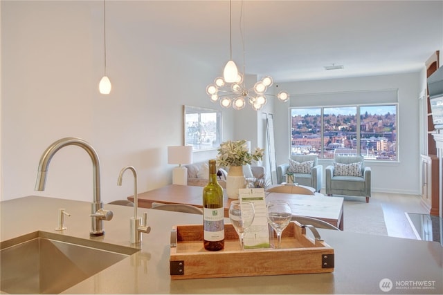 dining area featuring plenty of natural light, visible vents, and an inviting chandelier