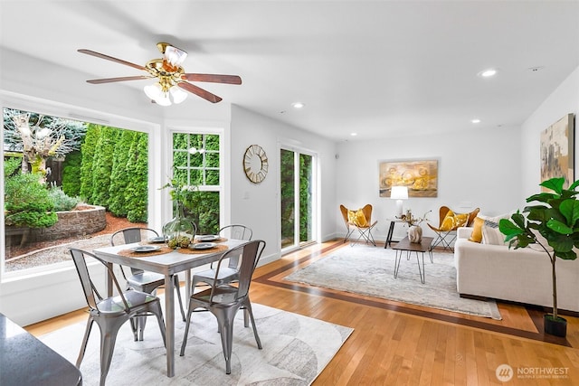 dining space featuring light wood finished floors, recessed lighting, baseboards, and ceiling fan