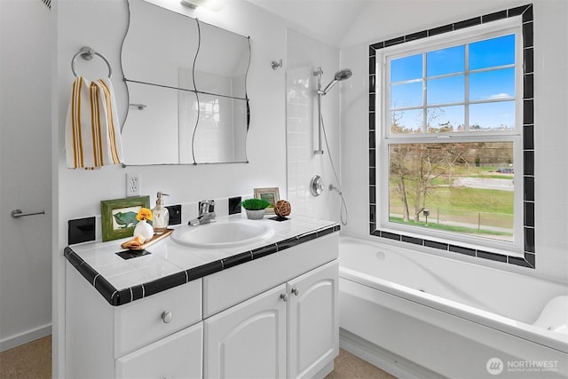 bathroom with a healthy amount of sunlight, vanity, shower / bathtub combination, and lofted ceiling