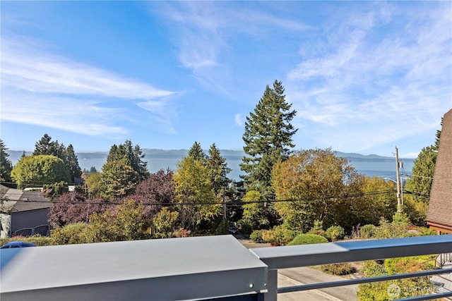 balcony with a water and mountain view