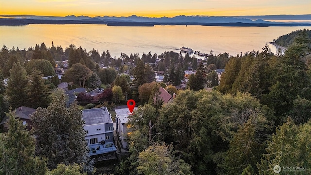 aerial view at dusk with a water and mountain view