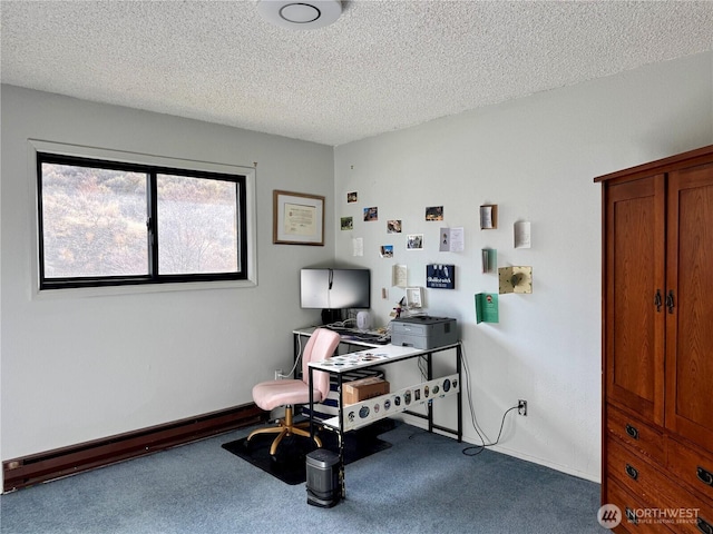 office featuring a textured ceiling, carpet, and baseboards