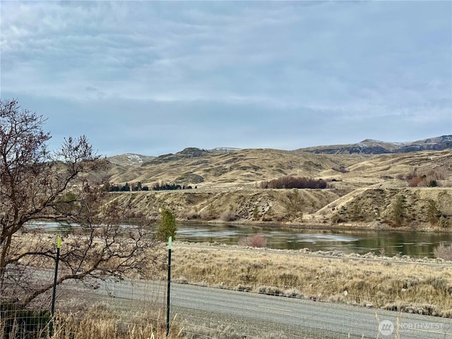 property view of mountains featuring a water view