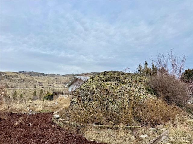 view of mountain feature with a rural view